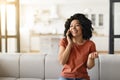 Portrait Of Happy Young Black Woman Talking On Mobile Phone At Home Royalty Free Stock Photo