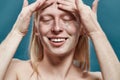 Young guy applying peeling mask on forehead Royalty Free Stock Photo