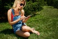 Portrait of happy young blondy woman college student use tablet