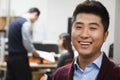 Portrait of happy young businessman in the office Royalty Free Stock Photo