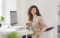 Portrait of a happy young businesswoman or financial accountant in an office workplace Royalty Free Stock Photo