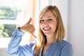 Happy Businesswoman Making Call Me Gesture Royalty Free Stock Photo