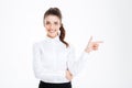 Portrait of a happy young businesswoman pointing finger away Royalty Free Stock Photo