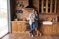 Portrait of happy couple pose in modern home kitchen Royalty Free Stock Photo