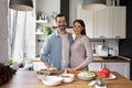 Portrait of smiling couple posing in new home kitchen Royalty Free Stock Photo