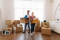 Couple holding cardboard box at home Royalty Free Stock Photo