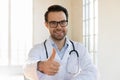 Portrait of smiling male doctor show thumb up Royalty Free Stock Photo