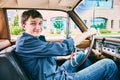 Portrait of happy young man driving his car Royalty Free Stock Photo