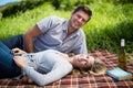 Portrait of happy young couple enjoying on blanket Royalty Free Stock Photo