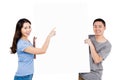 Portrait of happy young couple holding blank billboard Royalty Free Stock Photo