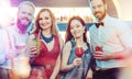 Happy couple holding drinks in the night club Royalty Free Stock Photo