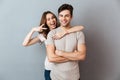 Portrait of a happy young couple hugging while standing Royalty Free Stock Photo