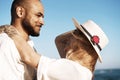 Portrait of happy young couple in love embracing each other on beach Royalty Free Stock Photo