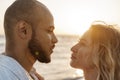 Portrait of happy young couple in love embracing each other on beach Royalty Free Stock Photo