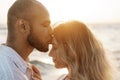 Portrait of happy young couple in love embracing each other on beach Royalty Free Stock Photo