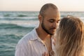 Portrait of happy young couple in love embracing each other on beach Royalty Free Stock Photo