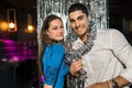 Happy young couple posing together at nightclub Royalty Free Stock Photo