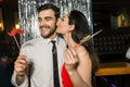 Happy young couple posing together at nightclub Royalty Free Stock Photo