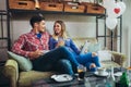 Portrait of happy young couple using a digital tablet together at coffee shop Royalty Free Stock Photo