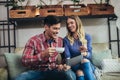 Portrait of happy young couple using a digital tablet together at coffee shop Royalty Free Stock Photo