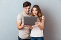 Portrait of a happy young couple using laptop computer Royalty Free Stock Photo