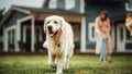 Portrait of a Happy Young Family Couple with Kids and a Golden Retriever Sitting on a Grass at Home Royalty Free Stock Photo