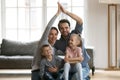 Portrait of happy young family with kids in new home Royalty Free Stock Photo