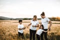 Portrait of a happy young family smiling in the countryside. Concept of family fun in nature Royalty Free Stock Photo