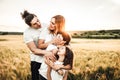 Portrait of a happy young family smiling in the countryside. Concept of family fun in nature Royalty Free Stock Photo