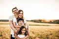 Portrait of a happy young family smiling in the countryside. Concept of family fun in nature Royalty Free Stock Photo