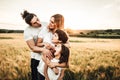 Portrait of a happy young family smiling in the countryside. Concept of family fun in nature Royalty Free Stock Photo