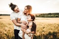 Portrait of a happy young family smiling in the countryside. Concept of family fun in nature Royalty Free Stock Photo