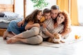 Portrait of a happy young family with two children and red fluffy cat Royalty Free Stock Photo