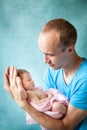 Portrait of father hugging his newborn baby Royalty Free Stock Photo