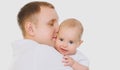 Portrait of happy young father with little baby isolated on a white background Royalty Free Stock Photo