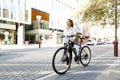 Portrait of happy young female bicyclist