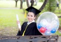 Portrait of happy young female graduates in academic dress Royalty Free Stock Photo