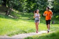 Portrait of happy fit people running together ourdoors. Couple sport healthy lifetsyle concept