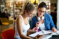 Portrait of happy young people studying together in a library. Education study teenager concept Royalty Free Stock Photo