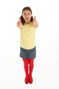 Portrait Of Happy young Girl Giving Thumbs Up Royalty Free Stock Photo