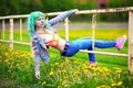 Portrait happy young girl on holi color festival hangs on an old fence Royalty Free Stock Photo