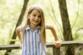 Portrait of a happy young girl outdoors forest Royalty Free Stock Photo