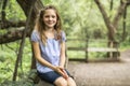 Portrait of a happy young girl outdoors forest Royalty Free Stock Photo