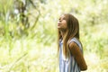 Portrait of a happy young girl outdoors forest Royalty Free Stock Photo