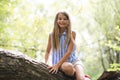 Portrait of a happy young girl outdoors forest Royalty Free Stock Photo