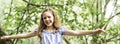 Portrait of a happy young girl outdoors forest balanced Royalty Free Stock Photo