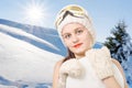 Portrait of a happy young girl snowboarding with goggles Royalty Free Stock Photo