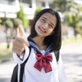 Portrait happy young girl wears a uniform at school Royalty Free Stock Photo