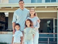 Portrait of a happy young hispanic family enjoying a fun day out in the backyard. Mixed race mother and father standing Royalty Free Stock Photo