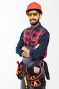 Portrait of happy young indian male construction worker with tool belt isolated on white background